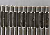 Nadelspitzen nach konventionellem Schleifen: Grate im Vergleichsbild.